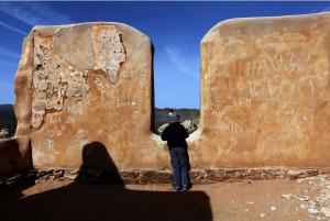 On a visit to Joshua Tree, 5-year-old Austin Serafin of San Diego explores historic remains of a structure tagged with graffiti at Ryan Ranch