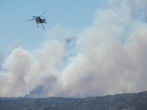 A helicopter returns from the Lakes Fire in Cajon Pass to refill in Silverwood Lake on July 17th.